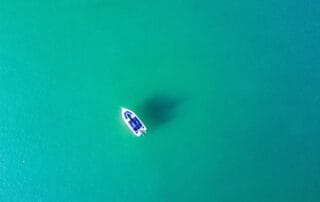 a boat drifitng in the ocean